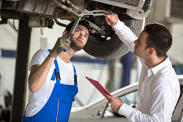 istock assessor and repair man examine car 496348954