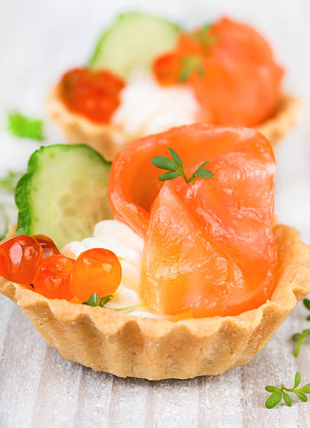 istock Tartlets with cream, pepper and cucumber 496349233