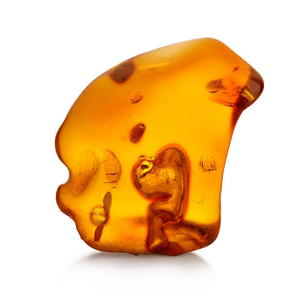 istock Piece of amber isolated on white background 496349382