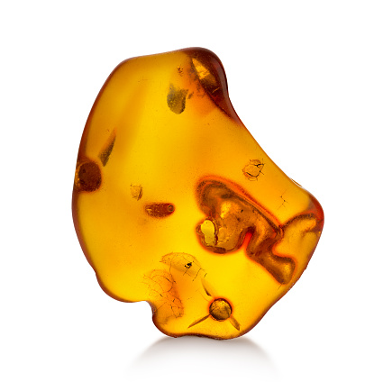 Piece of amber isolated on white background