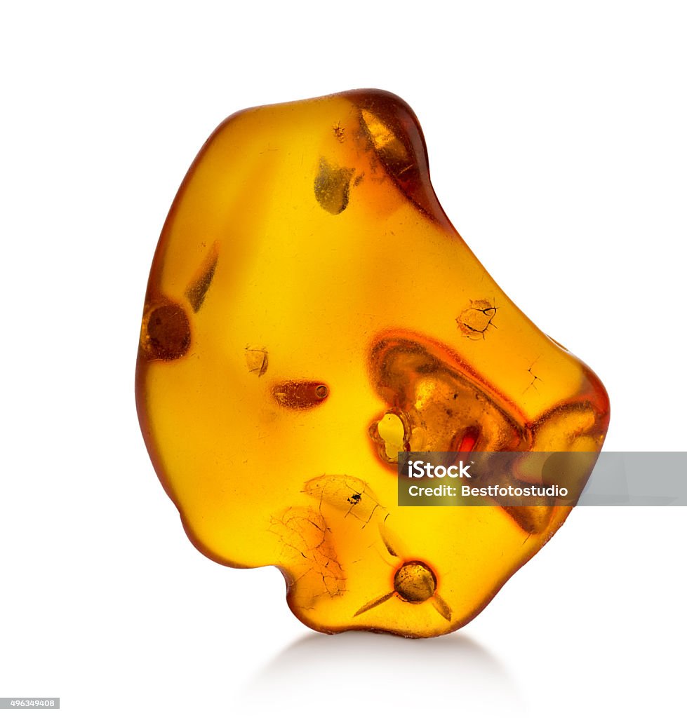 Piece of amber isolated on white background Amber Stock Photo