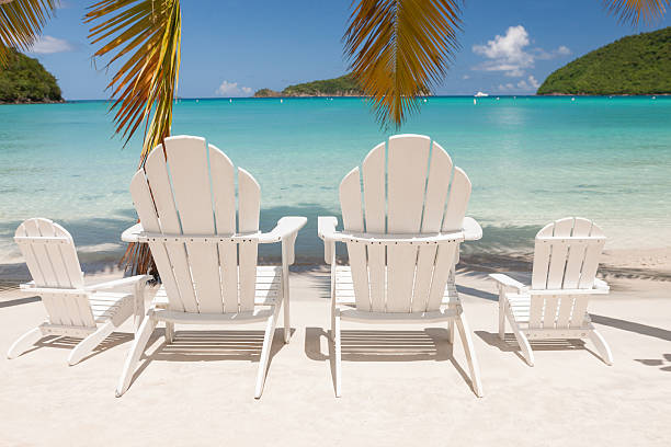 istock empty chairs on a beach at Maho Bay, St.John, USVI 496349766