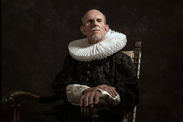 Official portrait of historical governor from the golden age. Official portrait of historical governor from the golden age. Sitting in chair. Studio shot against dark wall. period costume stock pictures, royalty-free photos & images