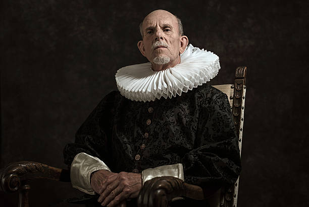 Official portrait of historical governor from the golden age. Official portrait of historical governor from the golden age. Sitting in chair. Studio shot against dark wall. neck ruff stock pictures, royalty-free photos & images