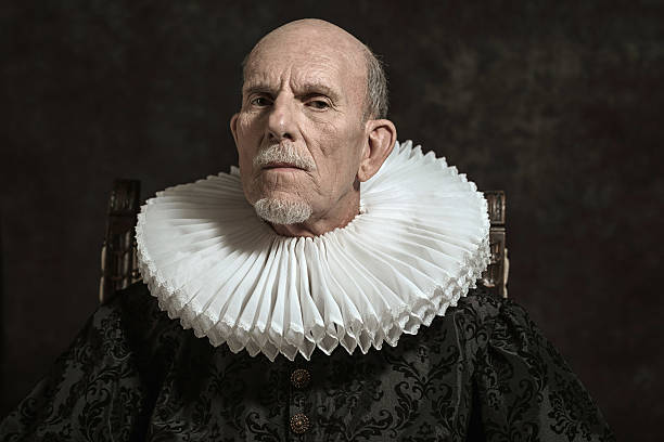 Official portrait of historical governor from the golden age. Official portrait of historical governor from the golden age. Sitting in chair. Studio shot against dark wall. neck ruff stock pictures, royalty-free photos & images