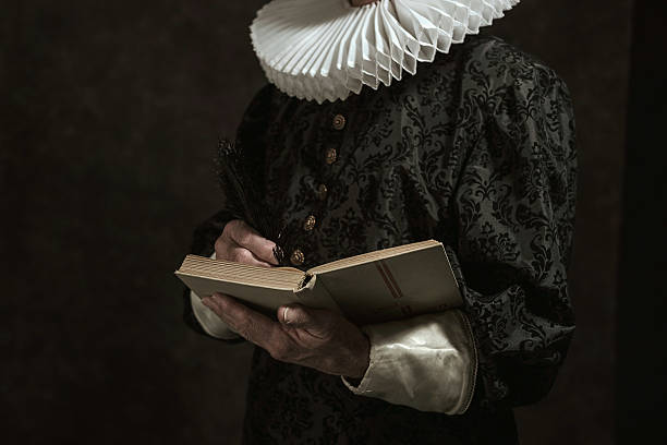 Hands of historical governor from the golden age. Hands of historical governor from the golden age. Writing in book. Studio shot against dark wall. neck ruff stock pictures, royalty-free photos & images