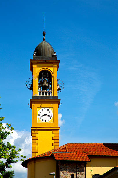 Old bell tower near Lecco on the shores of Lake Como with Mandello del Lario in the background.