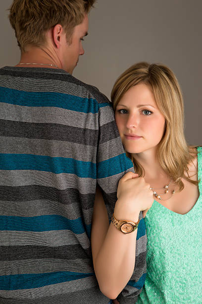 istock Woman holding man's arm. 496350871