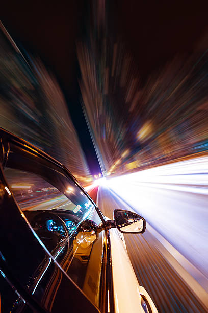 istock Car driving at night city 496351276