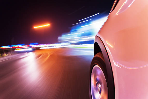 istock Car driving at night city 496351328