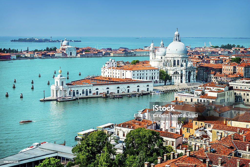 Venice, grand canal, Italy Beautiful view of the Grand Canal and Basilica Santa Maria della Salute in the late evening with very interesting clouds, Venice, Italy Venice - Italy Stock Photo