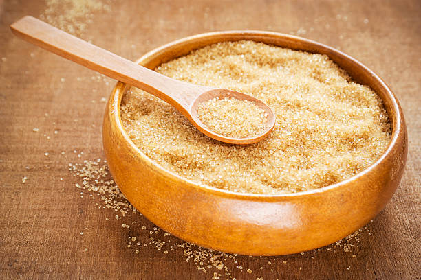 istock Brown sugar on wooden spoon 496351805