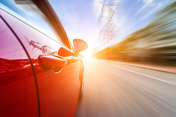 istock car driving on a motorway at high speeds 496351817