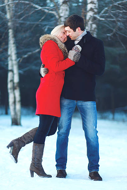 istock Happy beautiful couple hugging in winter cold day 496351998