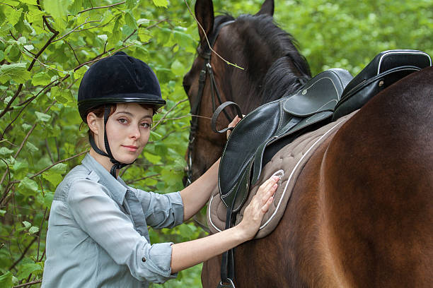 istock Girl with a horse in a forest 496352017