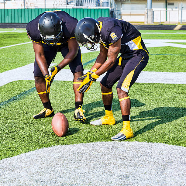 istock Two Football Players Celebrate after Scoring a Touchdown 496352399
