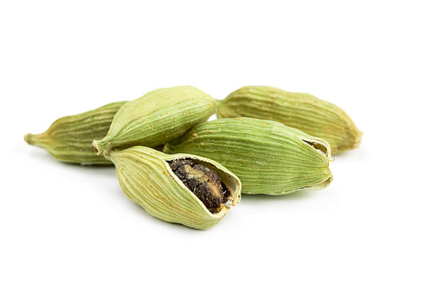 Pile of whole cardamom Pile of whole cardamom isolated on white background cardamom stock pictures, royalty-free photos & images