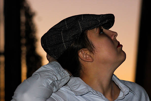 istock Side Profile of Woman Wearing Cap 496353740