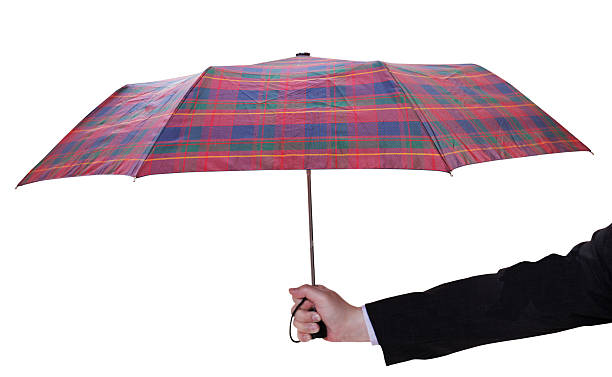 male hand with open checkered umbrella