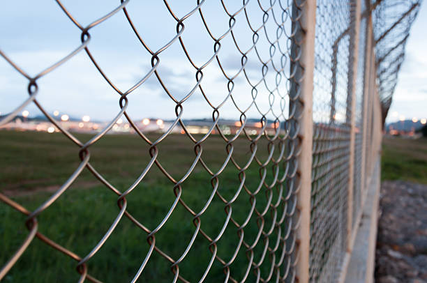 istock Fence around restricted area, Phuket Internatinal Airport, Thail 496353990