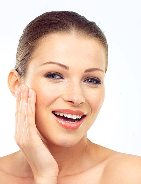 istock Beautiful young woman posing with her head in her hands 496354006