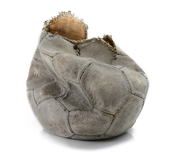 Broken football Broken football isolated broken toy stock pictures, royalty-free photos & images