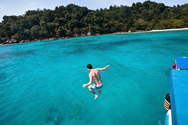 istock jumping to the sea 496355156