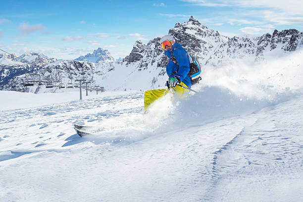 istock Skier skiing downhill in high mountains 496355960