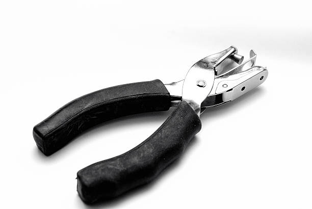 istock Hand operated peper hole punch for office use 496356816
