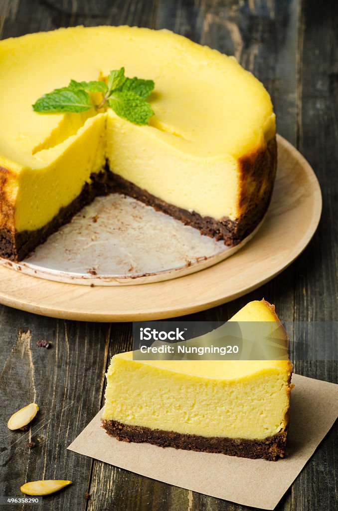 Pumpkin cheesecake Homemade pumpkin cheesecake on wooden background,Thanksgiving day 2015 Stock Photo