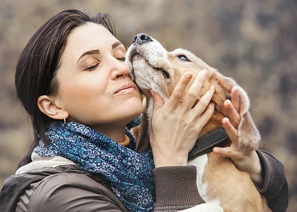 istock Woman and dog tender hugs 496358584