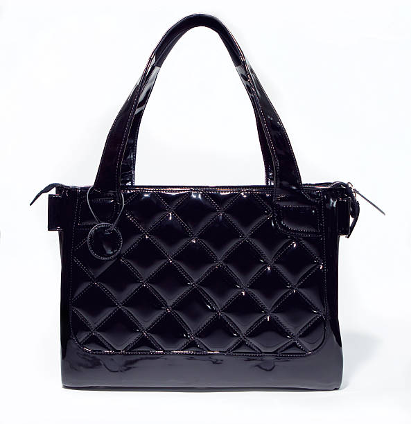 istock black womans purse on white background 496359746