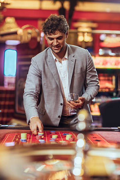 istock Man   gambling at roulette in casino 496360168
