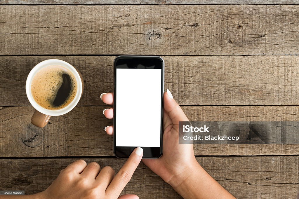 hand using phone white screen on top view Mobile Phone Stock Photo