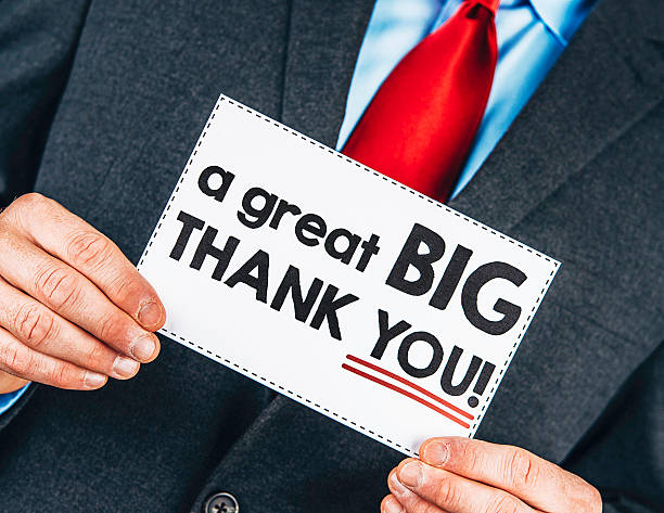 istock Businessman holding thank you sign 496376838