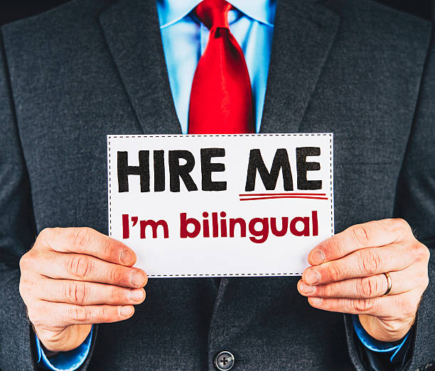 istock Businessman holding sign reading, I'm Bilingual 496376974