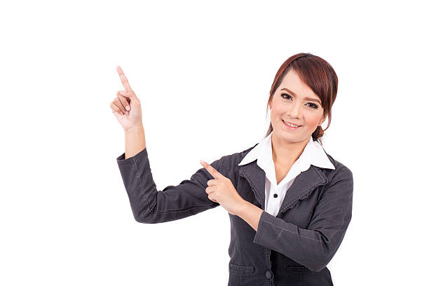 istock smiling young business woman hand point . suggest work. presentation 496378492