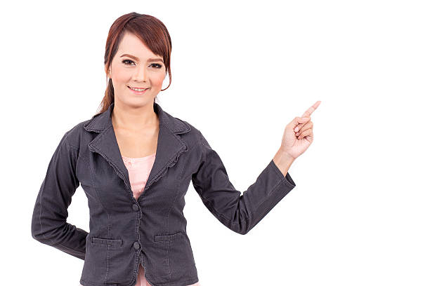 istock smiling young business woman hand point . suggest work. presentation 496378948