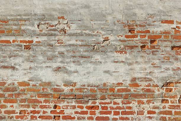 istock Red White Vintage Brick Painted Wall With Damaged Plaster 496380956