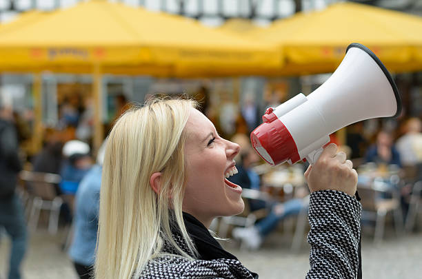 istock Woman yelling into a megaphone 496381558