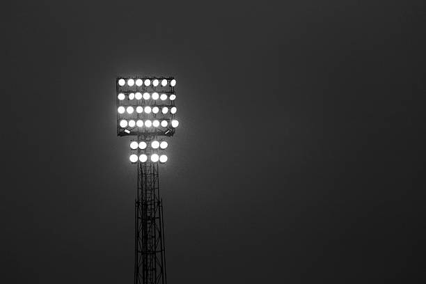 istock tower floodlights with many floodlights during the night show 496383854