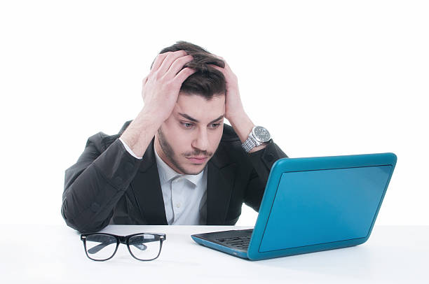 istock Young business man looking at his laptop with disappointment 496385040