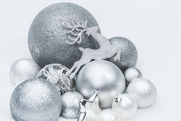 istock Festive silver grey shiny Christmas ornaments with reindeer on snow 496385122