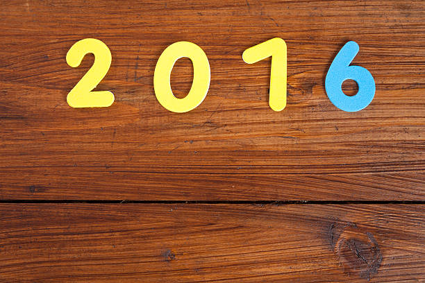 istock Year 2016, wooden background, copy space 496385172