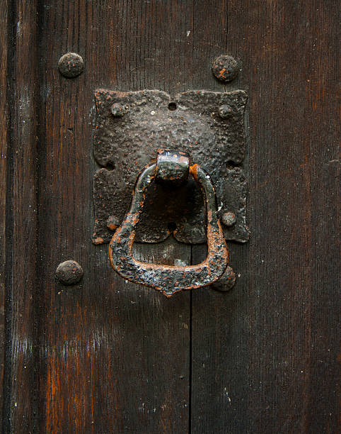 istock Knocker on a shabby door 496395997