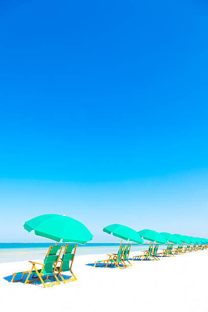 istock Lounge Chairs and Umbrella at the Beach 496396001
