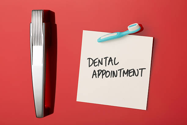 istock Dental appointment reminder on refrigerator door with toothbrush fridge magnet 496396671