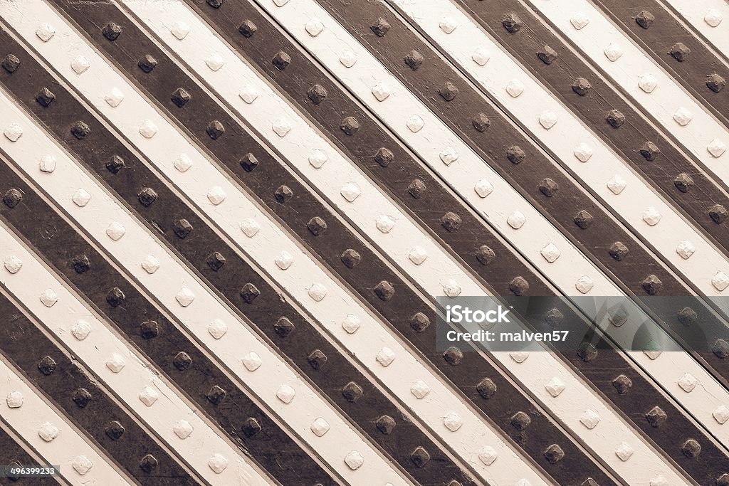 panel with brown beige slanting striped pattern fragment of the ancient riveted panel from the painted wooden boards with brown beige slanting striped pattern Beige Stock Photo