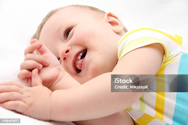 Happy Baby Lying In Bed Stock Photo - Download Image Now - 12-17 Months, Babies Only, Baby - Human Age