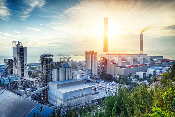 Glow light of petrochemical industry on sunset. coal power station and night blue sky industry stock pictures, royalty-free photos & images